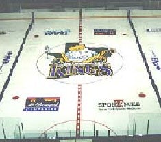 aerial view of the ice with advertising logos featured on the ice around the Kings logo.